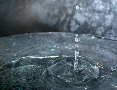 how do water droplets erode stones?
