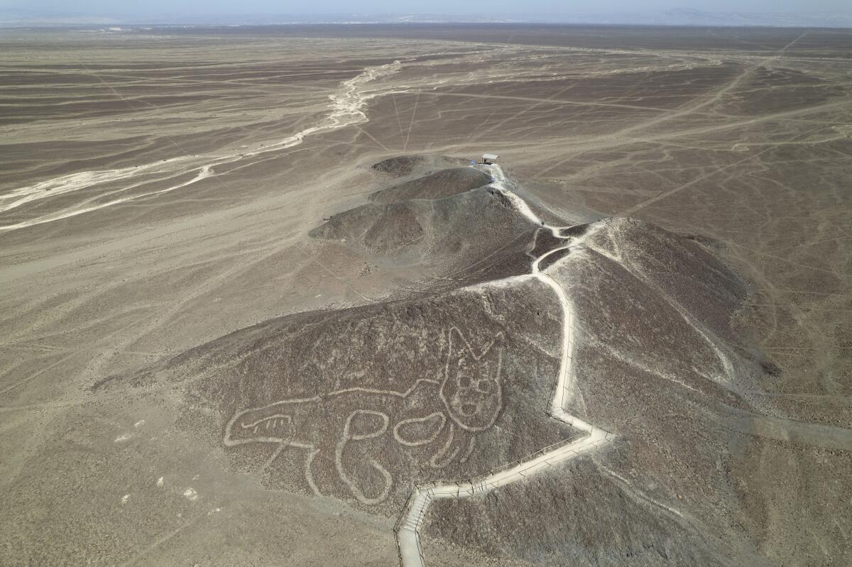 Even now new figures drawn on the sand still appear,